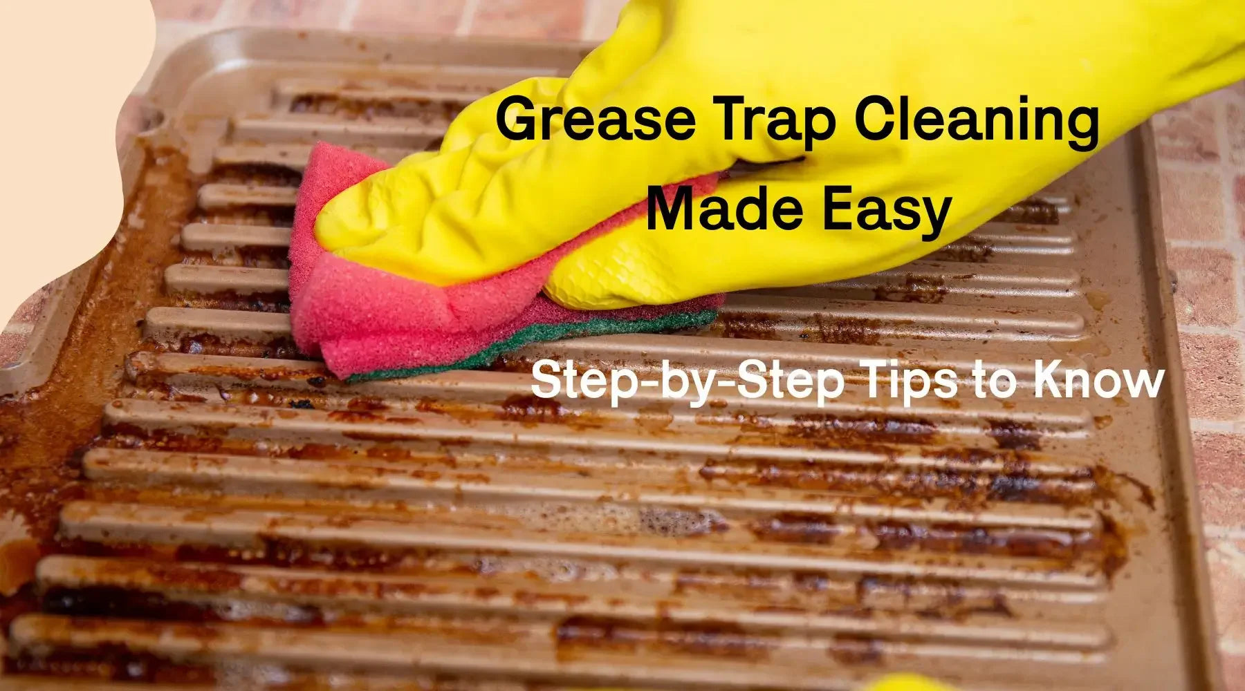 Gloved hand scrubbing greasy metal grease trap with sponge for cleaning tips